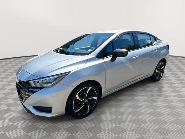 2024 Nissan Versa SR in Ro1 — front three-quarter view