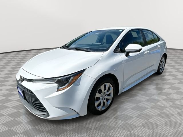 2024 Toyota Corolla LE in Ro1 — front three-quarter view